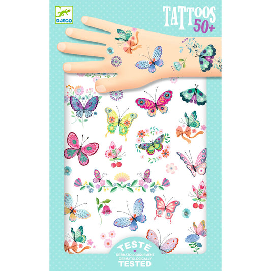 Djeco butterfly tattoos with a hand model on a light blue background